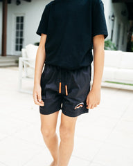 KIDS LIGHTS OUT SWIM TRUNKS